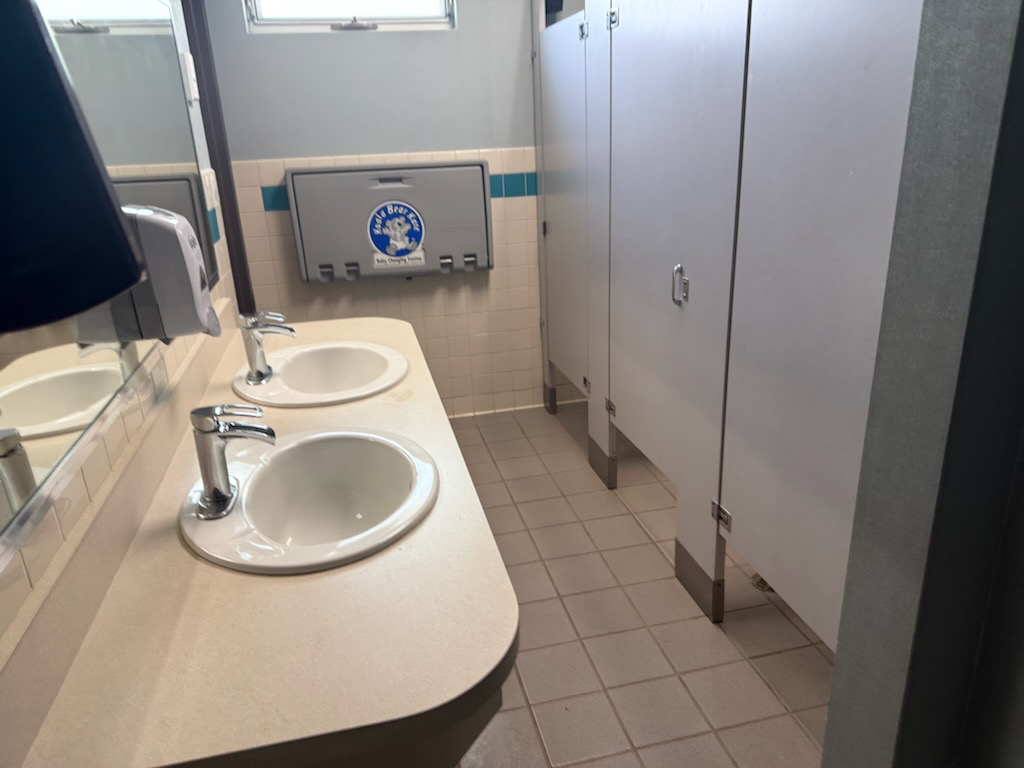 Commercial restroom sinks and counters cleaned by Team406